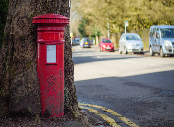 Decorative image showing a UK red post box