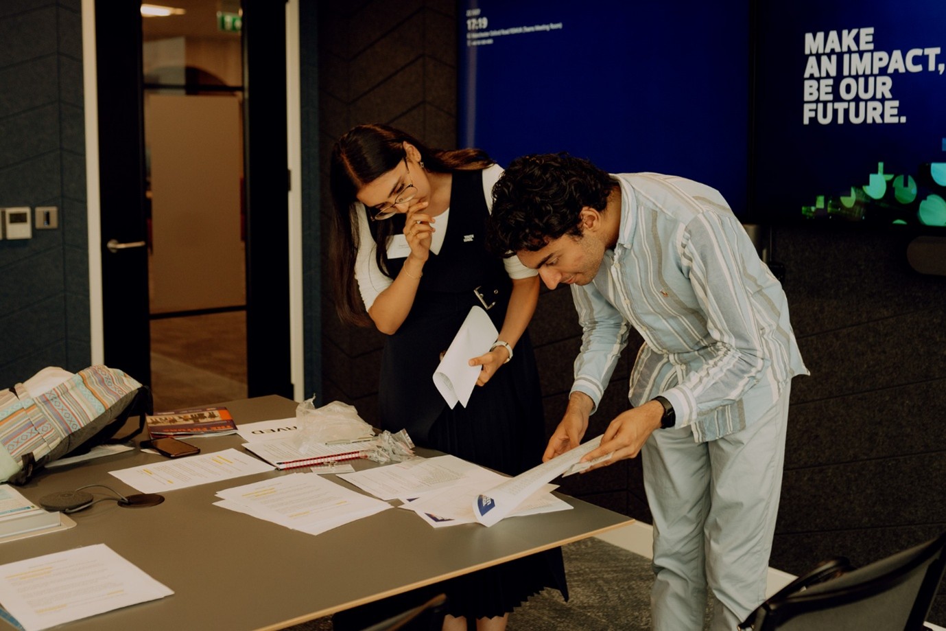Students-observing-civic-roles-documents Two students analysing paper documents