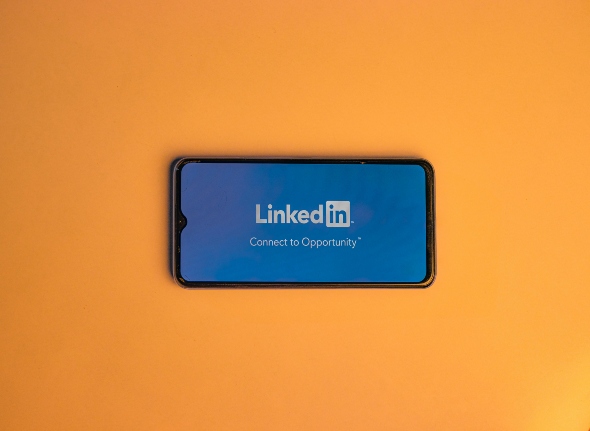 A phone with the LinkedIn logo displayed on it.