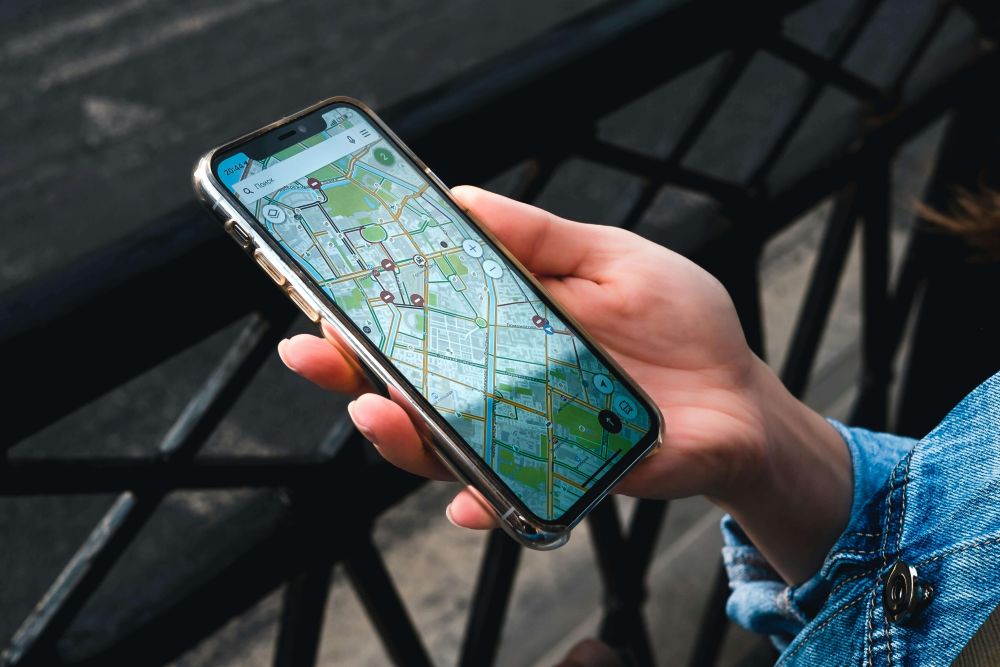 A phone with a map on in someone's hand