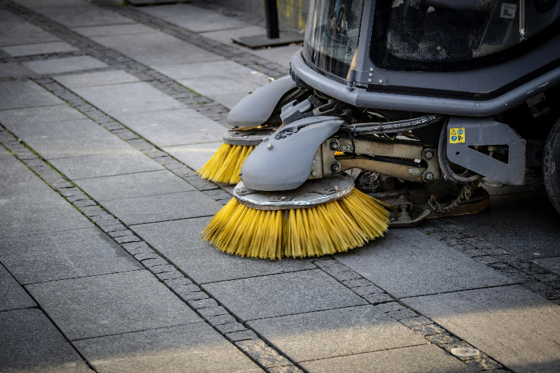 a roadsweeper on a road